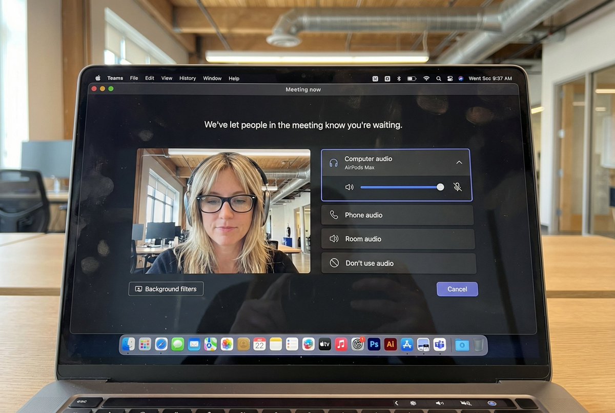 Create an ultra-high-resolution, indistinguishable-from-real iPhone photo of a MacBook screen displaying the Microsoft Teams meeting waiting room on macOS, with readable UI, accurate macOS dock/menu bar details, and subtle realistic screen reflections and artifacts.