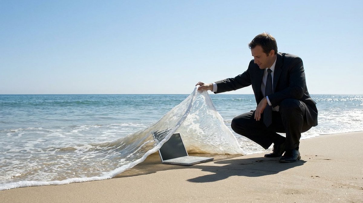 A surreal seaside scene where a subject lifts a wave like a carpet to reveal a hidden object beneath. Calm ocean waters and a clear blue sky heighten the clever, tangible-wave illusion.