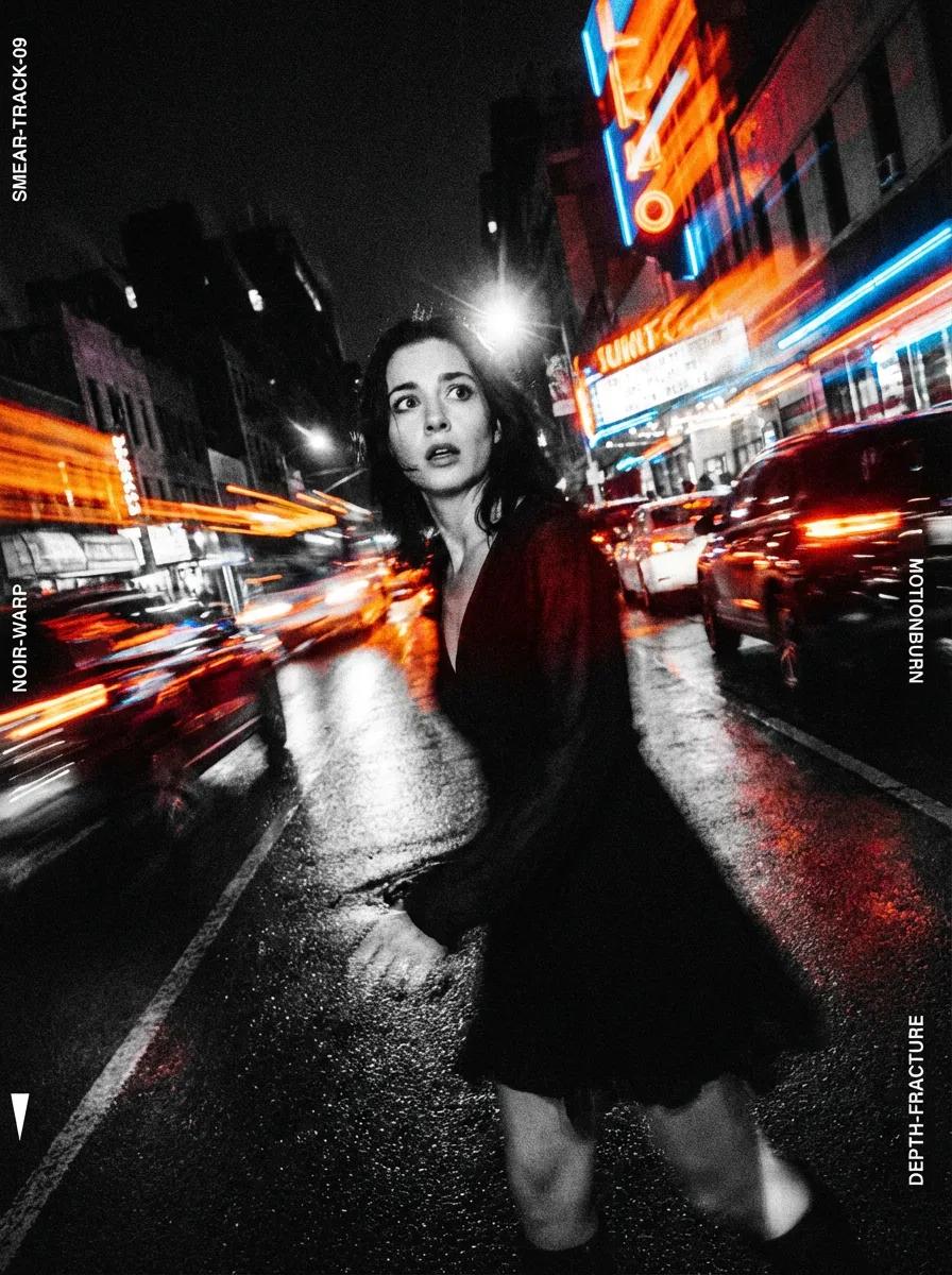 A planned yet raw noir street scene capturing a visual explosion amid fast-moving traffic, with frozen faces and sweeping motion trails from long-shutter exposure.
